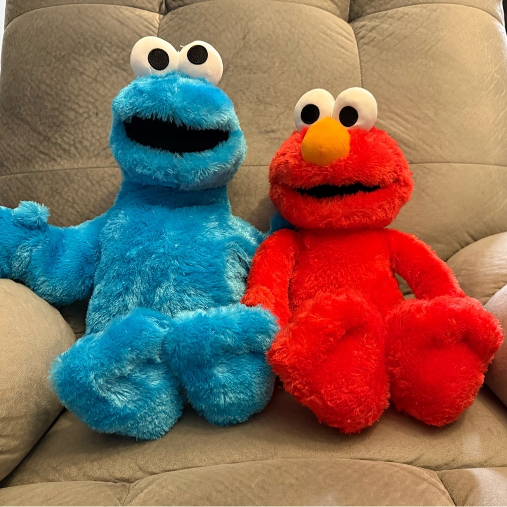 Sesame Street 18” Elmo plush and 20” Cookie Monster plush. Like new.
